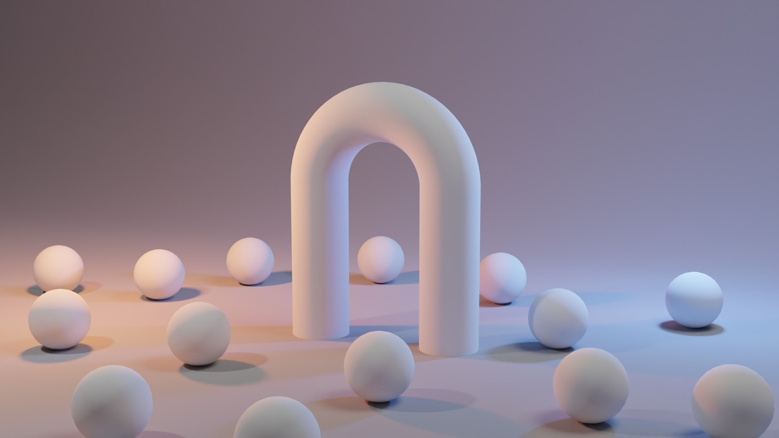 a group of white balls sitting next to a white arch